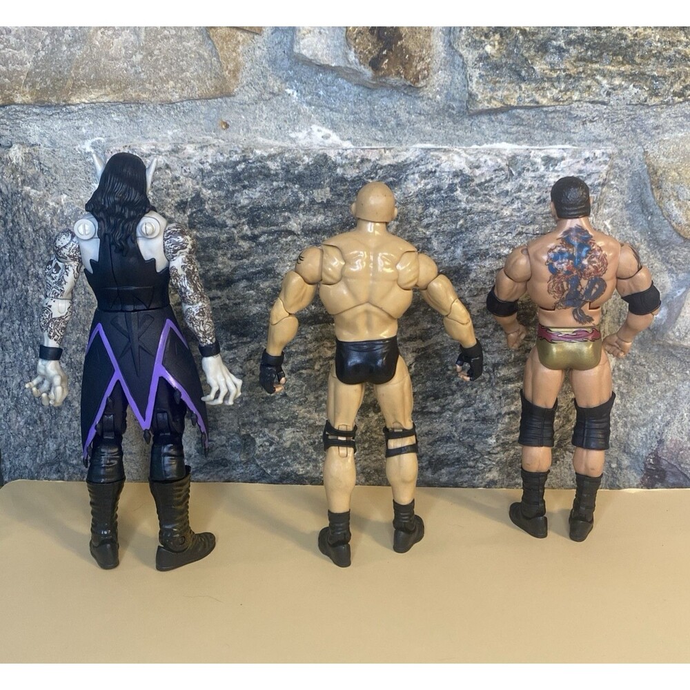 WWE Wrestling Action Figure Lot of 3 Vampire Undertaker Goldberg Batisa Loose